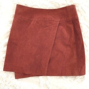 Faux leather burnt orange mini skirt. Size Small.